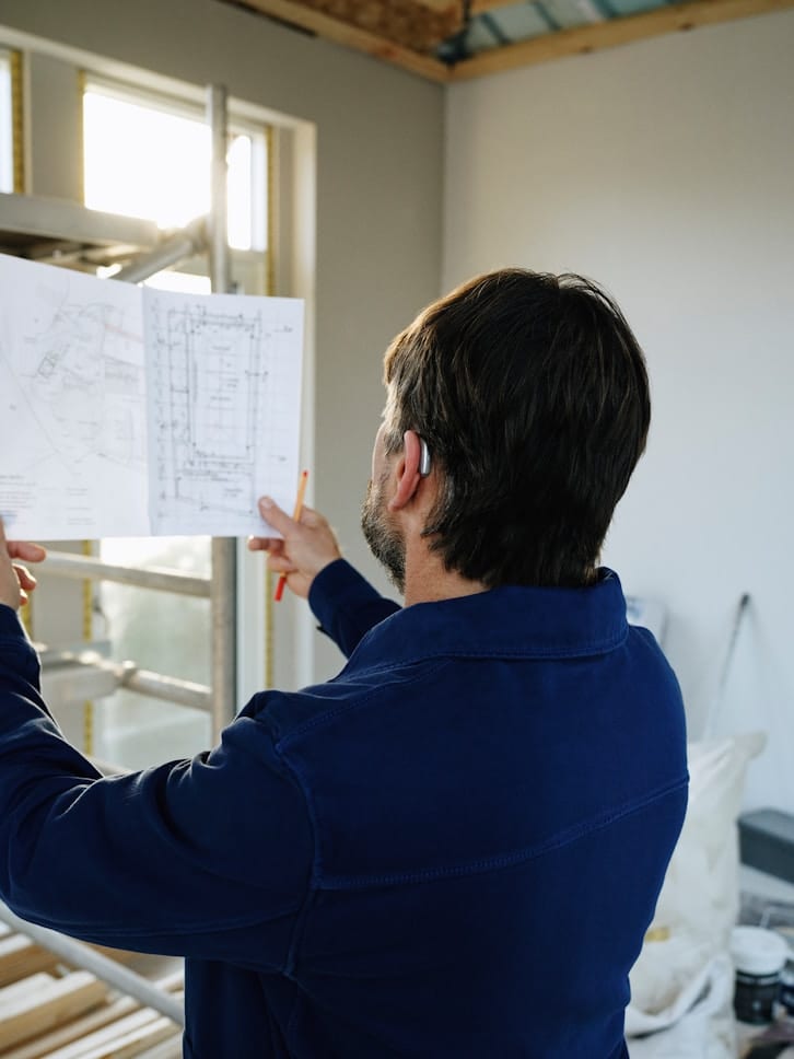 Reviewing blueprints on a construction site