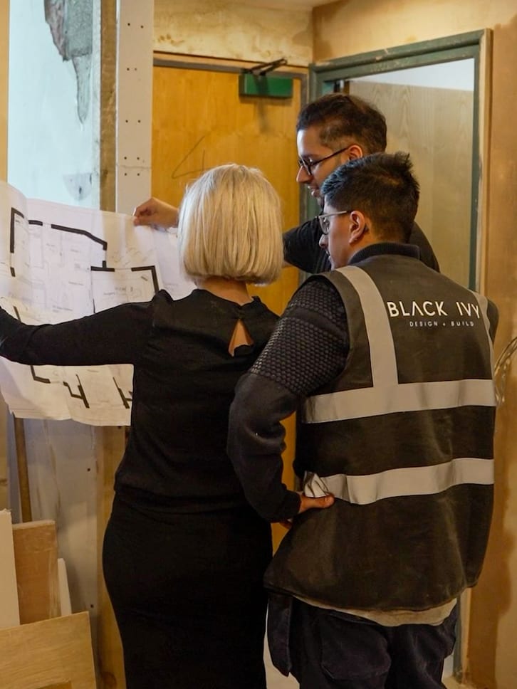 Reviewing blueprints on a construction site