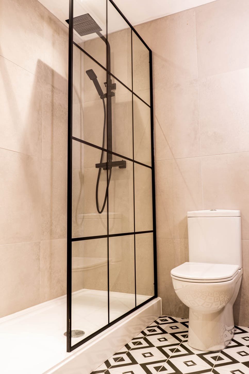 Jacobean Hotel bathroom with black-framed shower screen